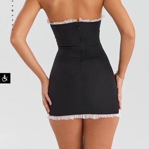 Mini black dress with baby pink ruffles